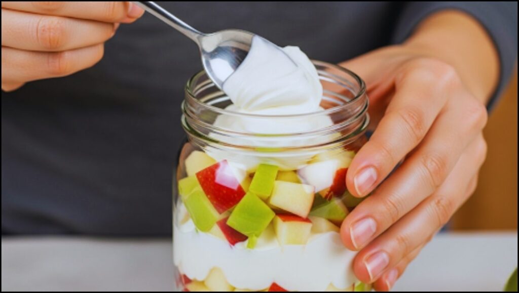 layering yogurt over apples
